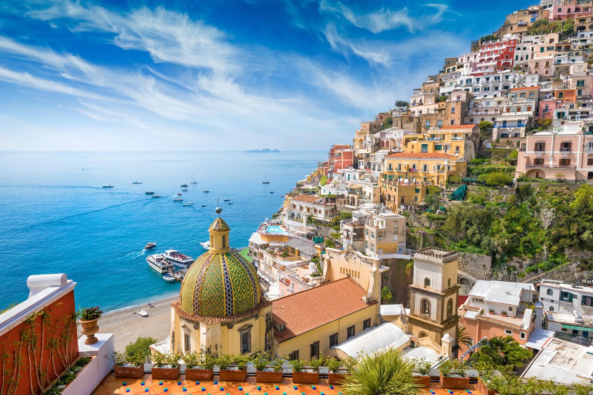 Pastel villages stacked above the Amalfi Coast sea