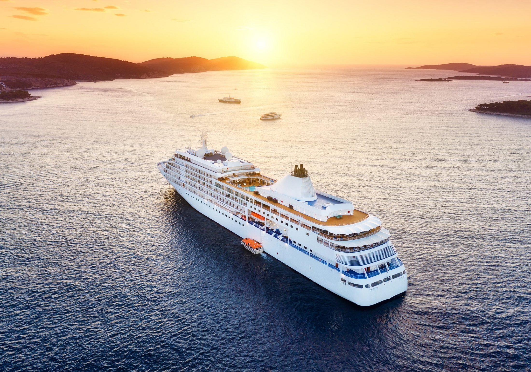 Cruise ship sailing through turquoise Caribbean water