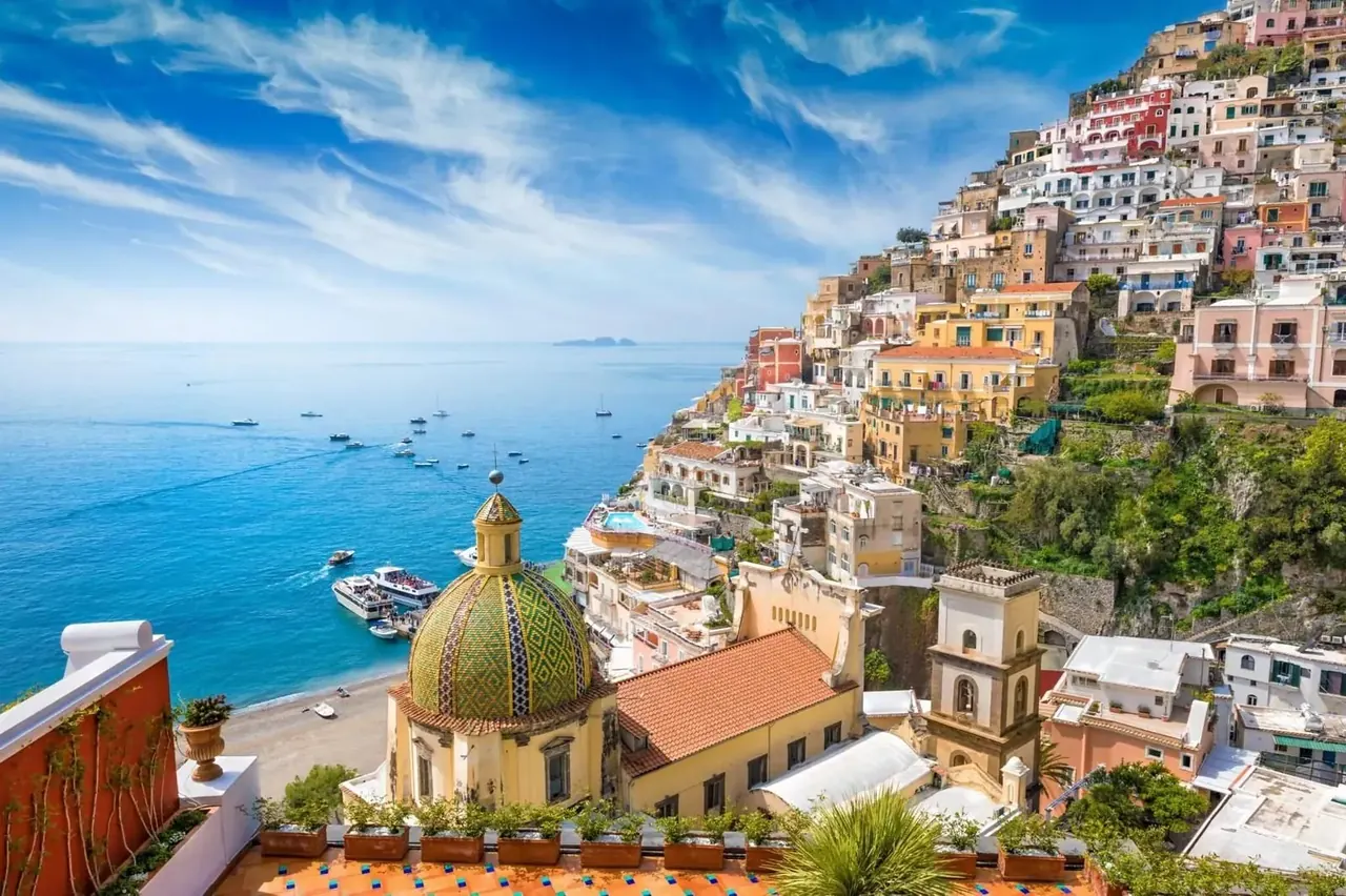 Colorful Positano houses stacked above the Amalfi Coast shoreline