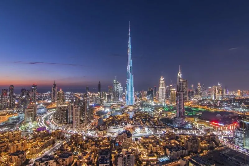 The Burj Khalifa and Dubai skyline glittering at night